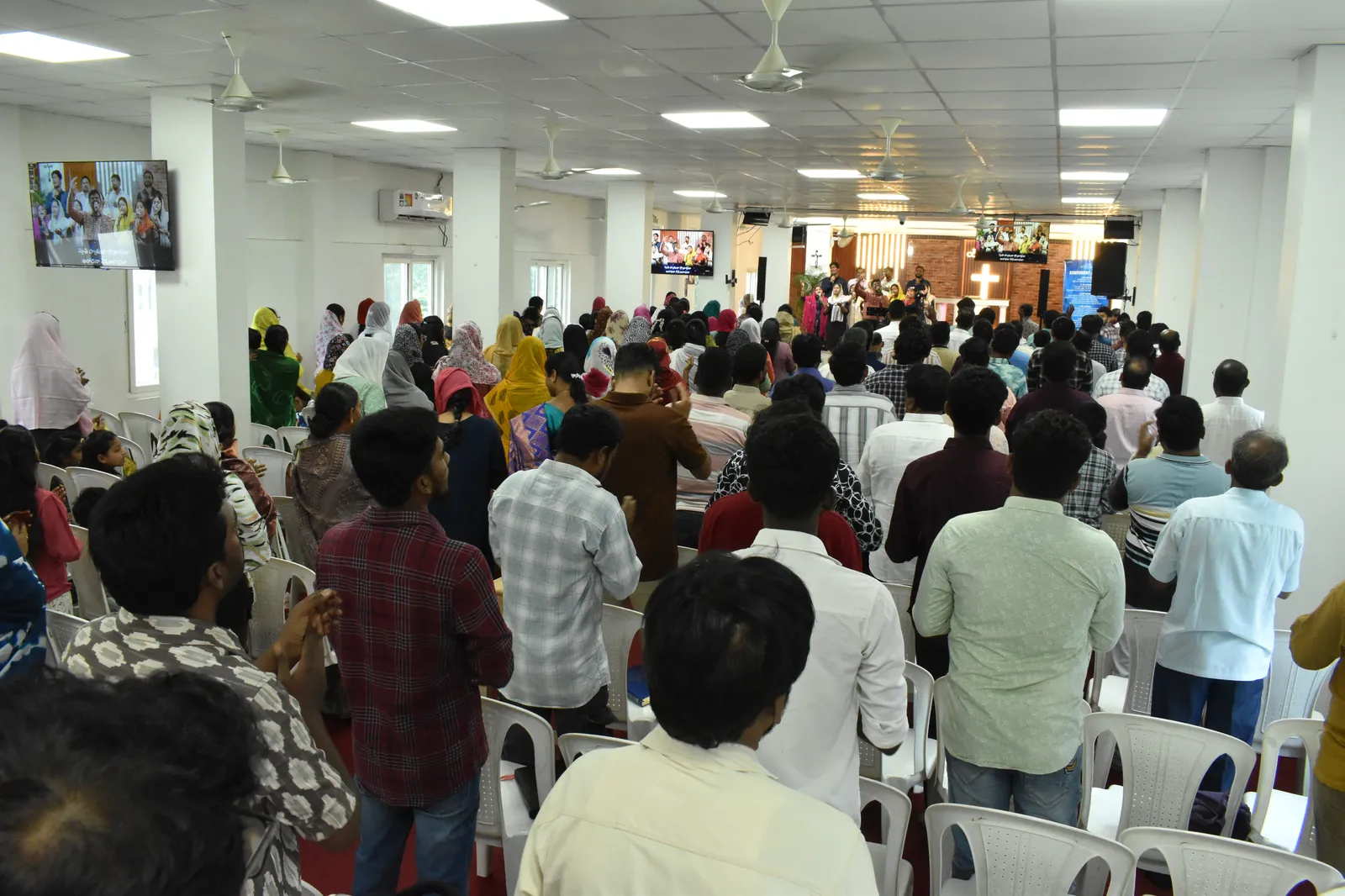 The New Covenant Church congregation gathered together in worship