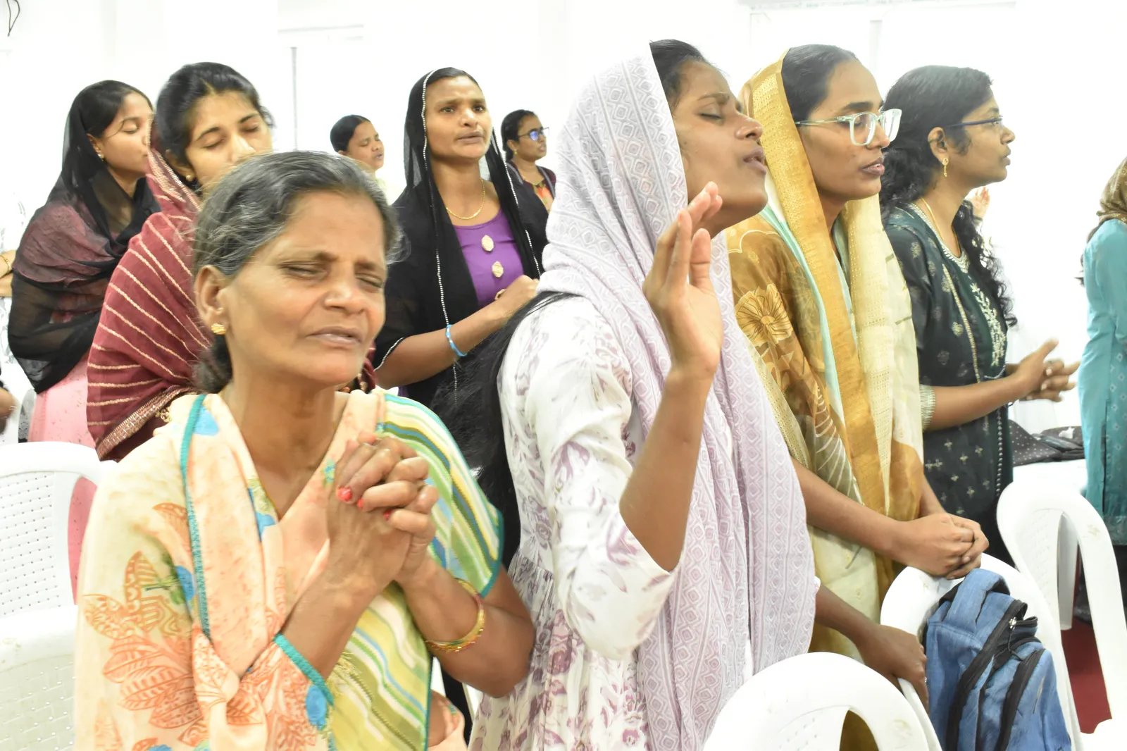 Members in prayer